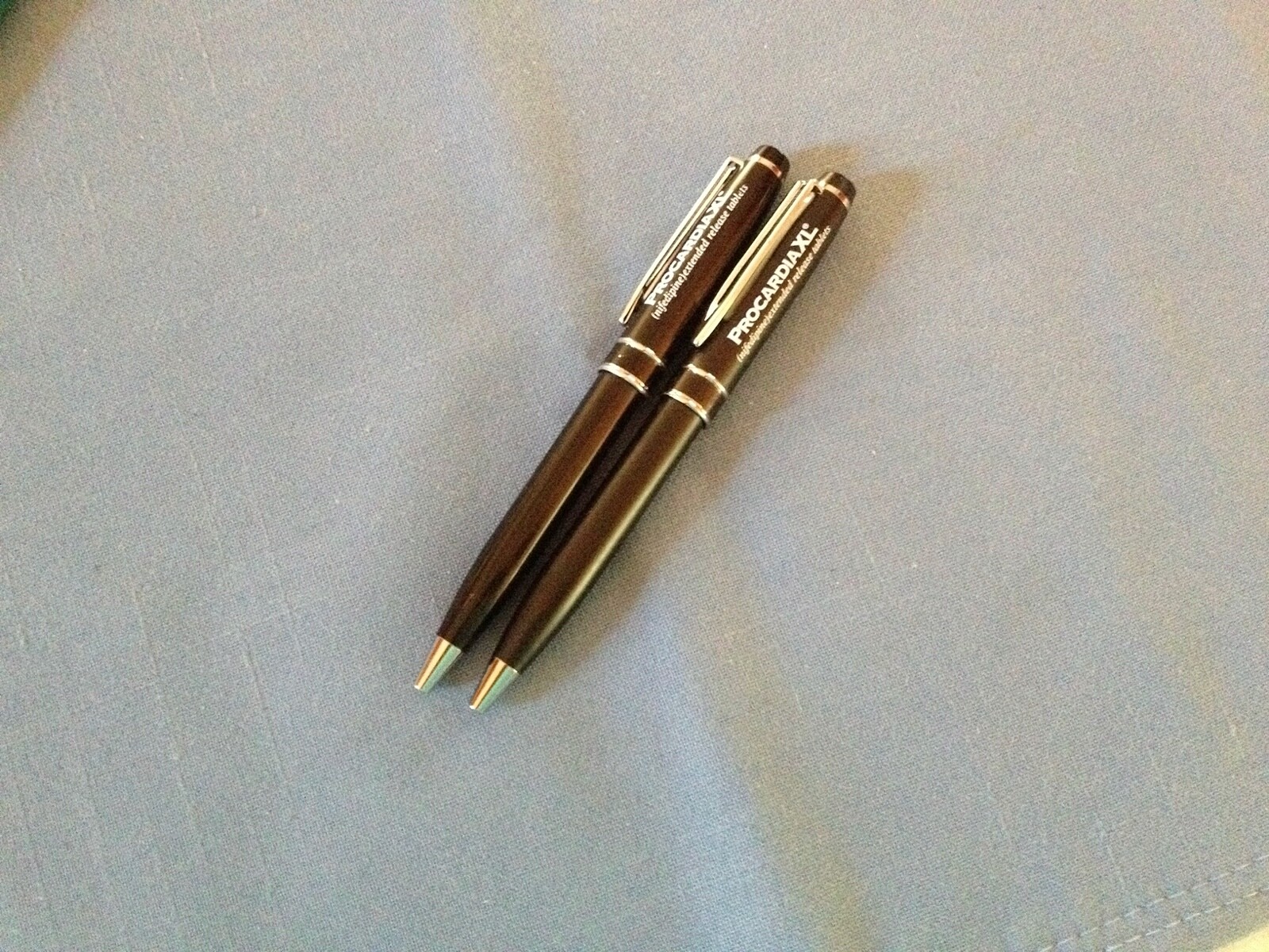 2 metal Procardia drug rep pens
