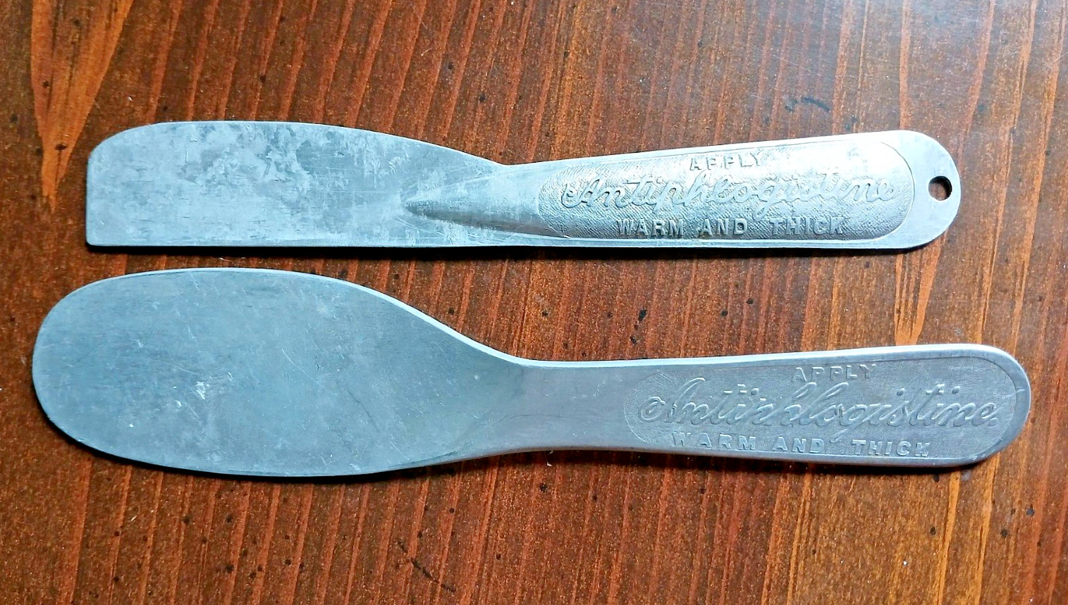 Two Vintage Advertising Antiphlogistine Muscle Rub Medicine Aluminum Applicators