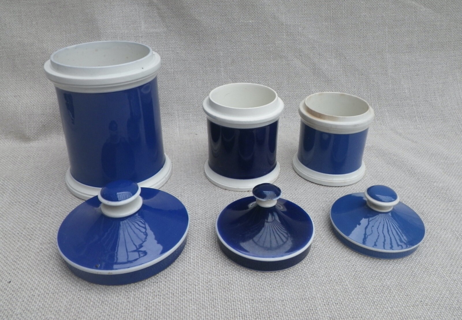 Collection of Small Blue Slip-Decorated Ceramic Apothecary Jars with Lids