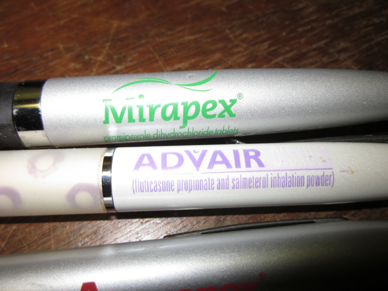 LOT OF 4 HEAVY METAL DRUG REP PENS- MIRAPEX, ADVAIR DISKUS, AND 2 AGGRENOX