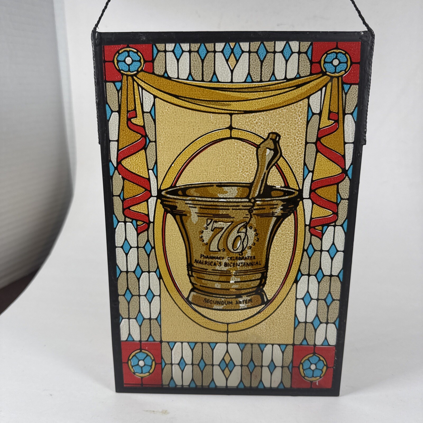 SECUNDUM ARTEM ’76, PHARMACY CELEBRATES AMERICA’S BICENTENNIAL STAINED GLASS