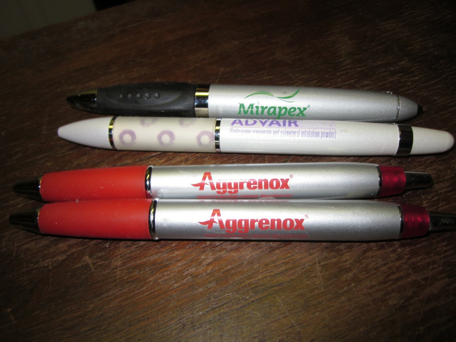 LOT OF 4 HEAVY METAL DRUG REP PENS- MIRAPEX, ADVAIR DISKUS, AND 2 AGGRENOX