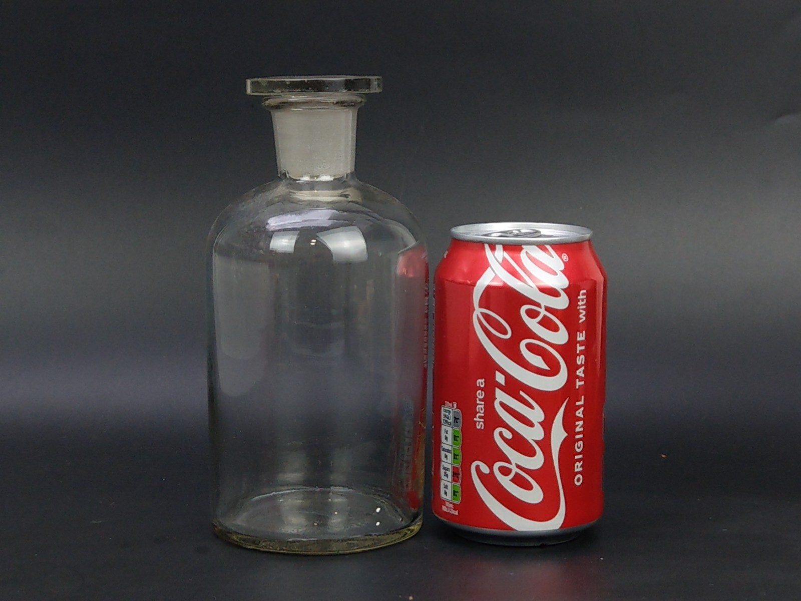 Antique chemist clear bottle with flat stopper This clear glass bottle from the