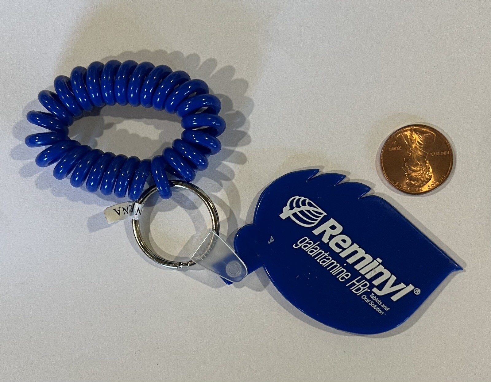 NEW Pharmaceutical Drug Rep REMINYL Wrist Key Chain 2002