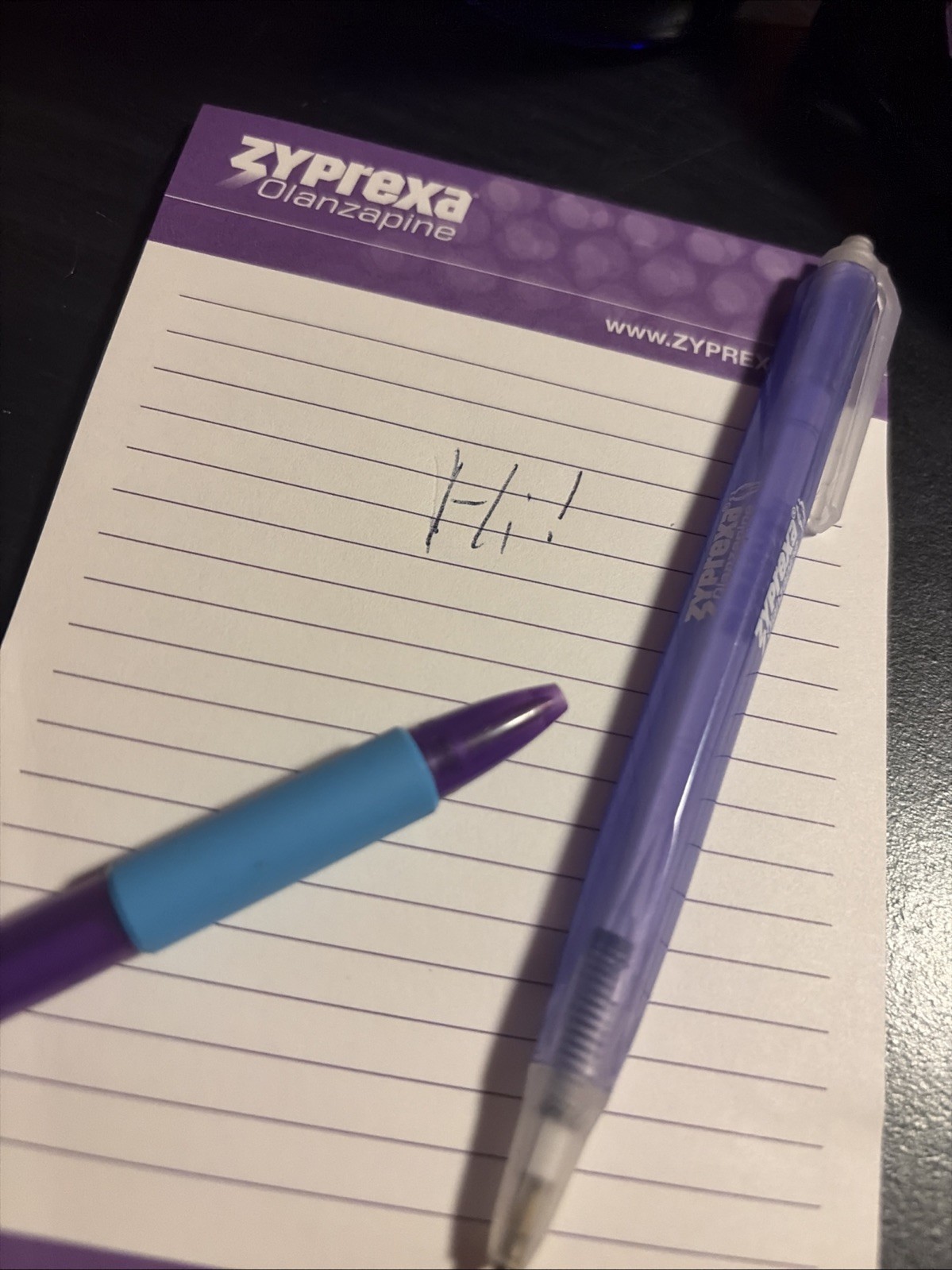 Zyprexa early 2000s collectible merch, 3 different pens, level, and mug