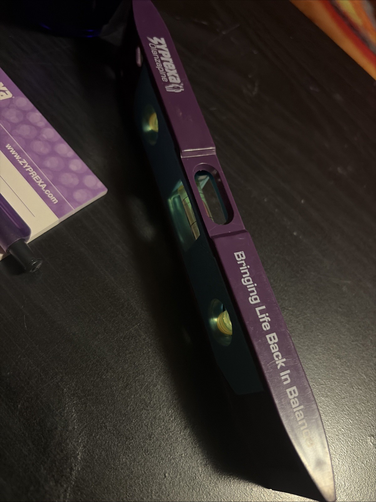 Zyprexa early 2000s collectible merch, 3 different pens, level, and mug