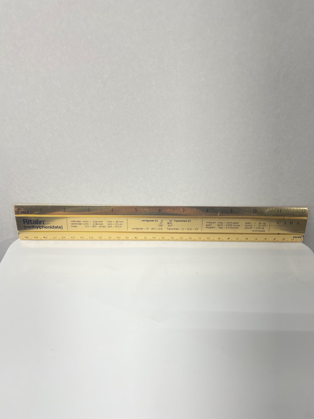 VINTAGE RITALIN CIBA 12″ METAL RULER! mm/METRIC CONVERSIONS! GOLD COLOR METAL!