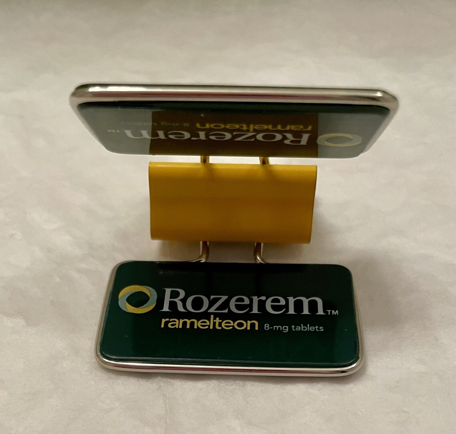 VINTAGE ROZEREM GREEN/YELLOW BINDER CLIP PHARMACEUTICAL DRUG REP LOGO NEW