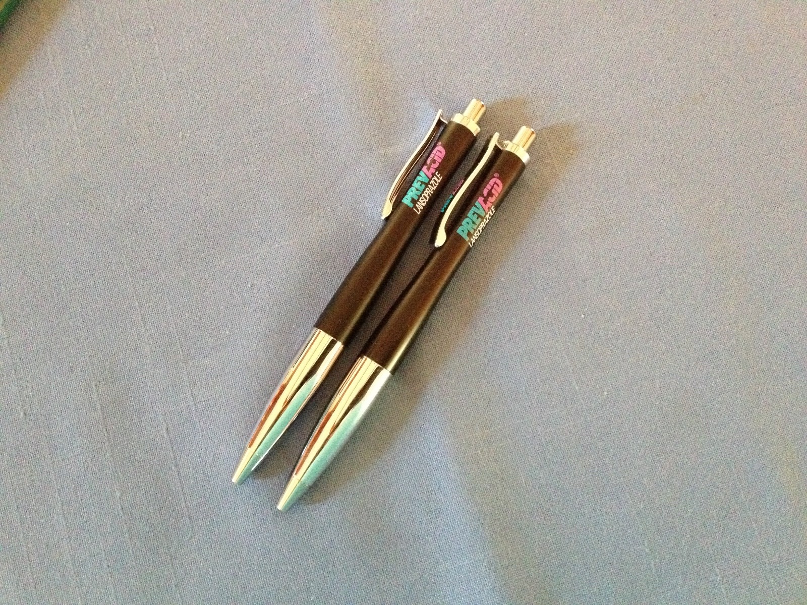2 metal Prevacid drug rep pens