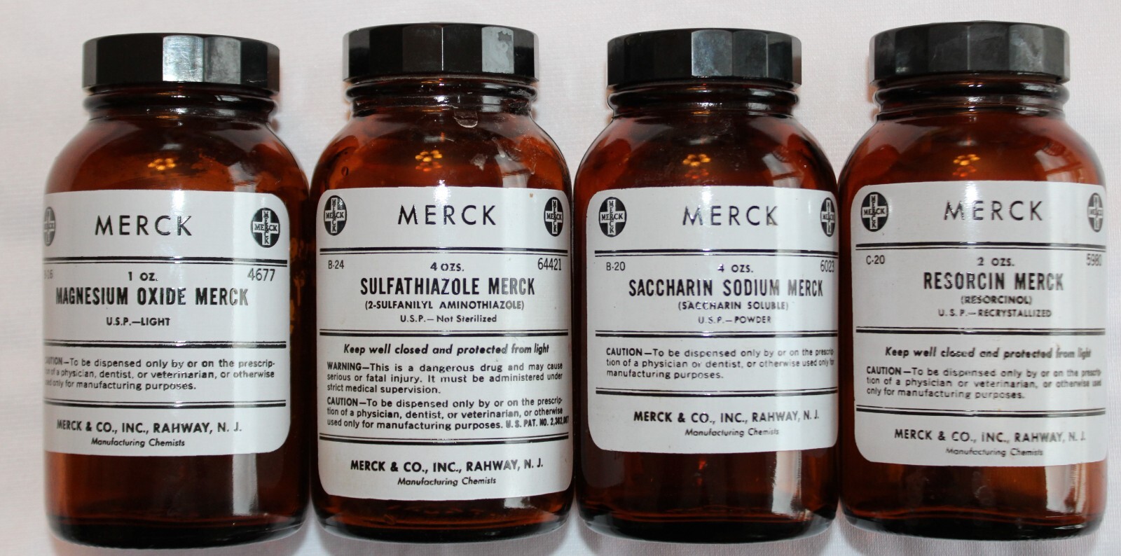 LOT OF 4 VINTAGE AMBER MEREK PHARMACEUTICAL APOTHECARY-MEDICINE BOTTLES 5″ JARS