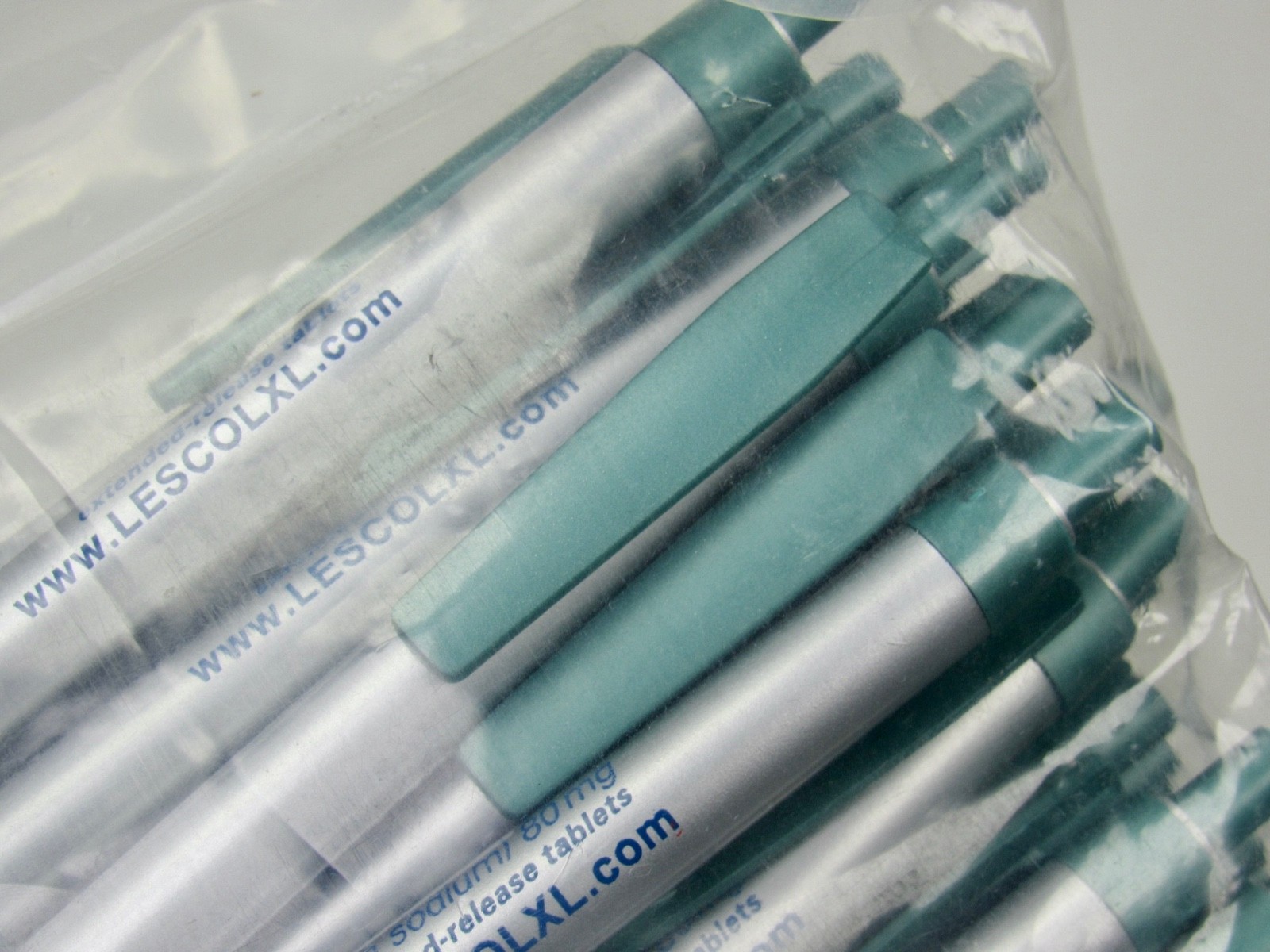 Lot of 50 Silver & Green Lescol XL Drug Rep Pharmaceutical Promo Pens Sealed Bag