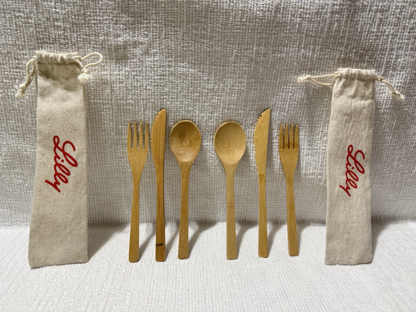 (2) Eli Lilly Pharma.Co.-3 Pc Wooden Cutlery Sets In Logo Canvas Drawstring Bags