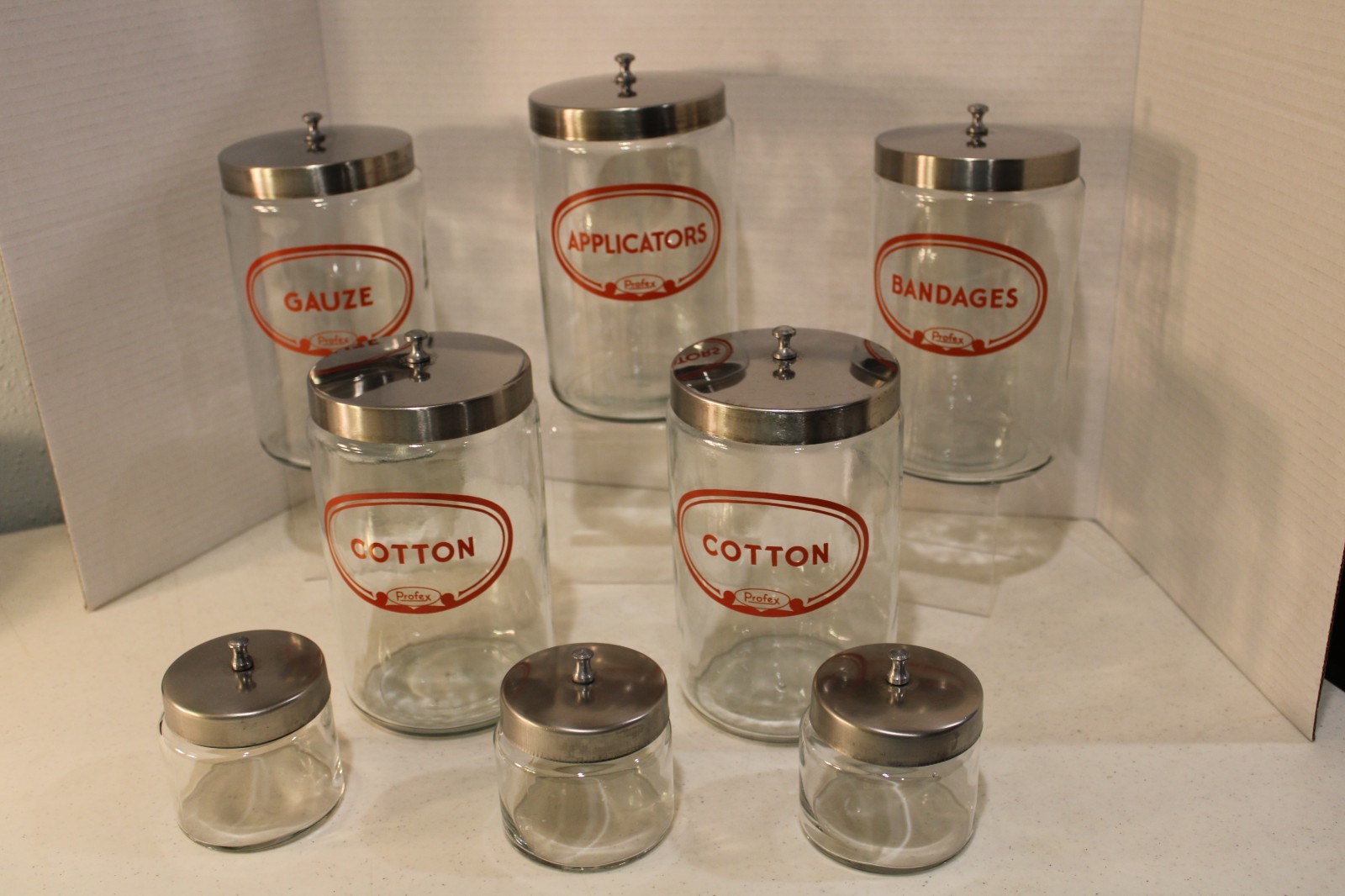VINTAGE SET OF PROFEX APOTHECARY JARS SET OF 8 7″ AND 3″ ORIGINAL LIDS NO DAMAGE