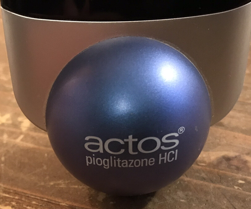 Actos Pharmaceutical Drug Rep Clock Alarm Date Balances On Ball
