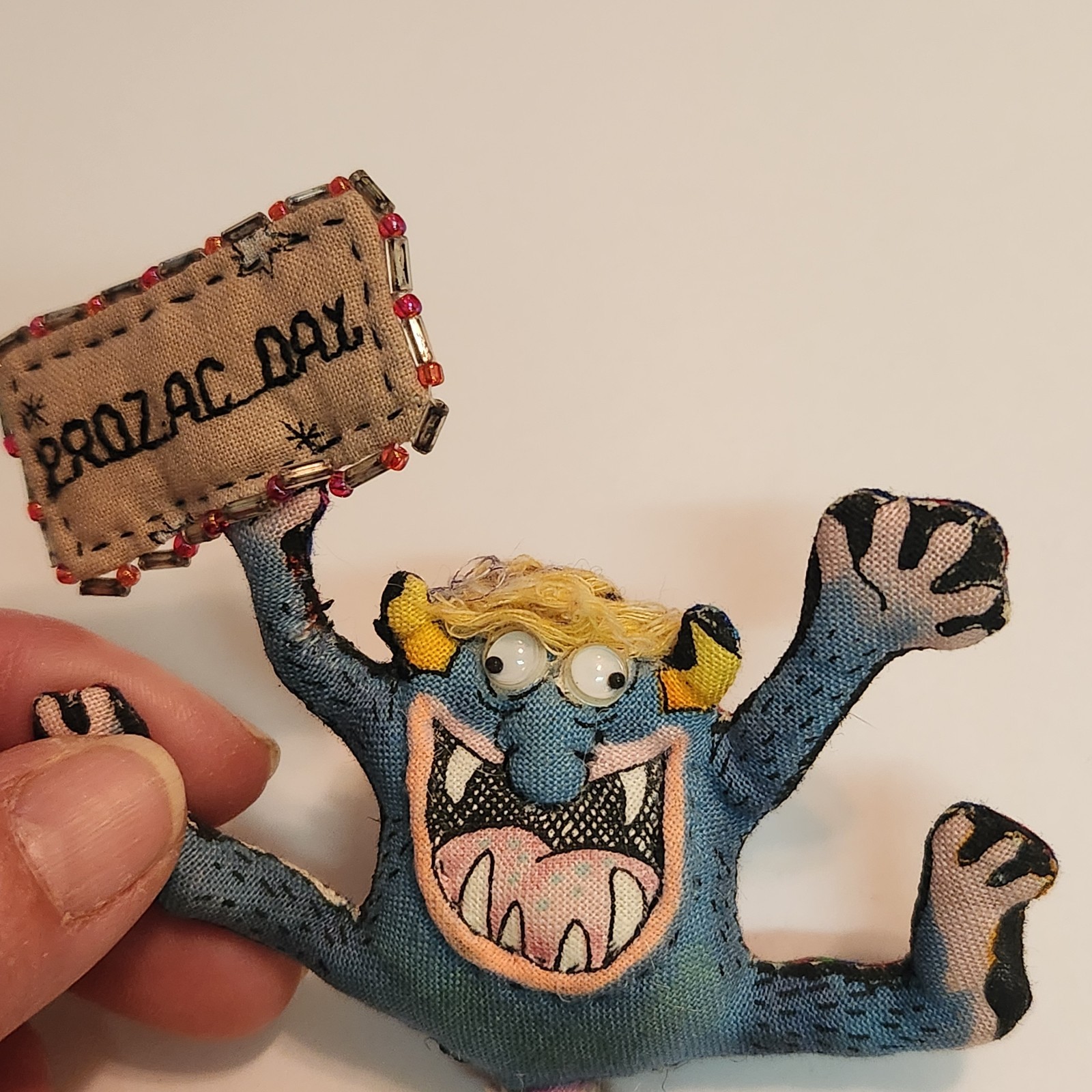 Vintage Hand Made ” Prozac Day ” Cloth Stuffed Goblin Monster Googley Eyes Pin