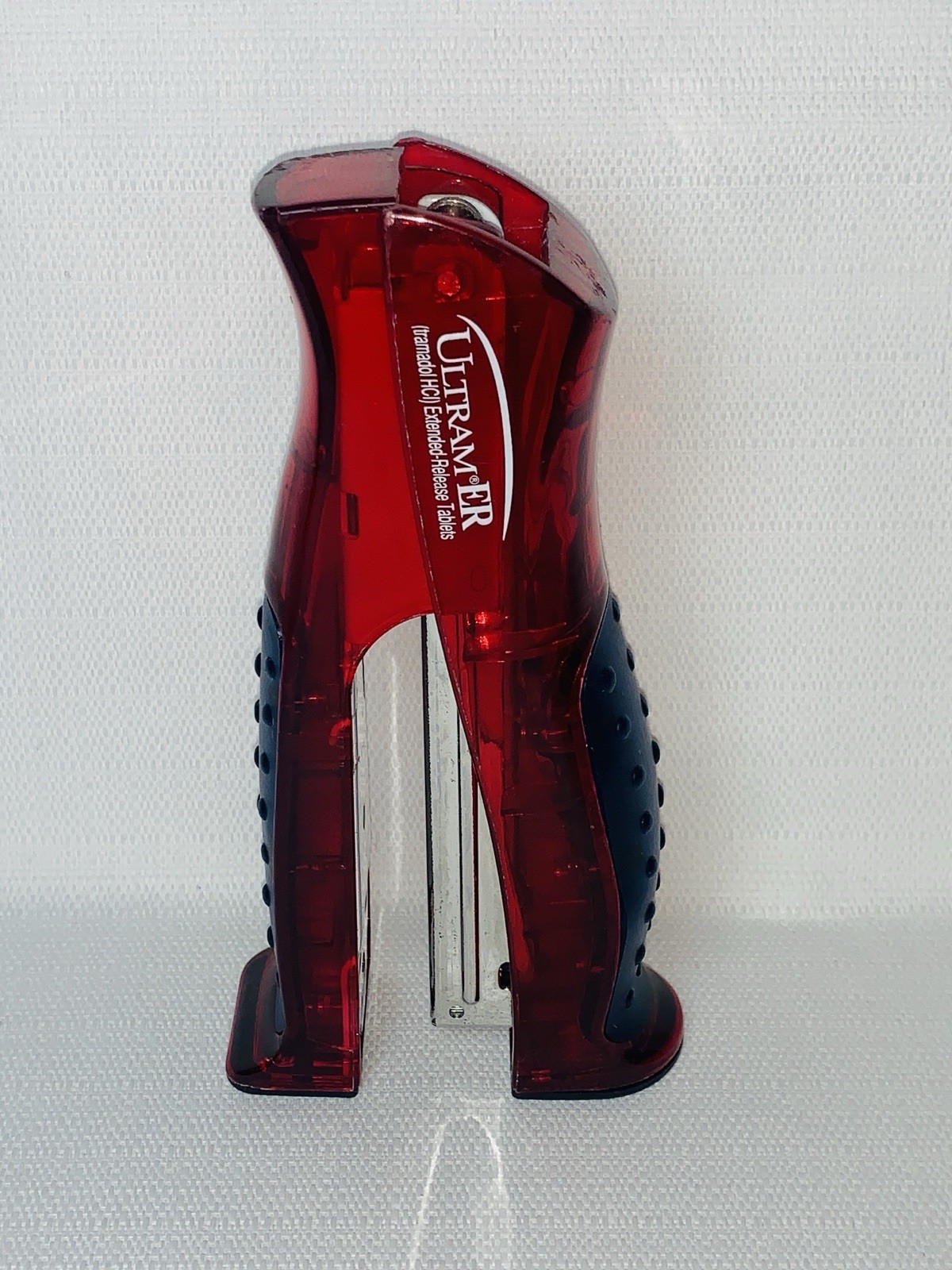 Ultram ER Drug Rep Promo Stapler – Red Translucent Stand-Up Ergonomic Squeeze