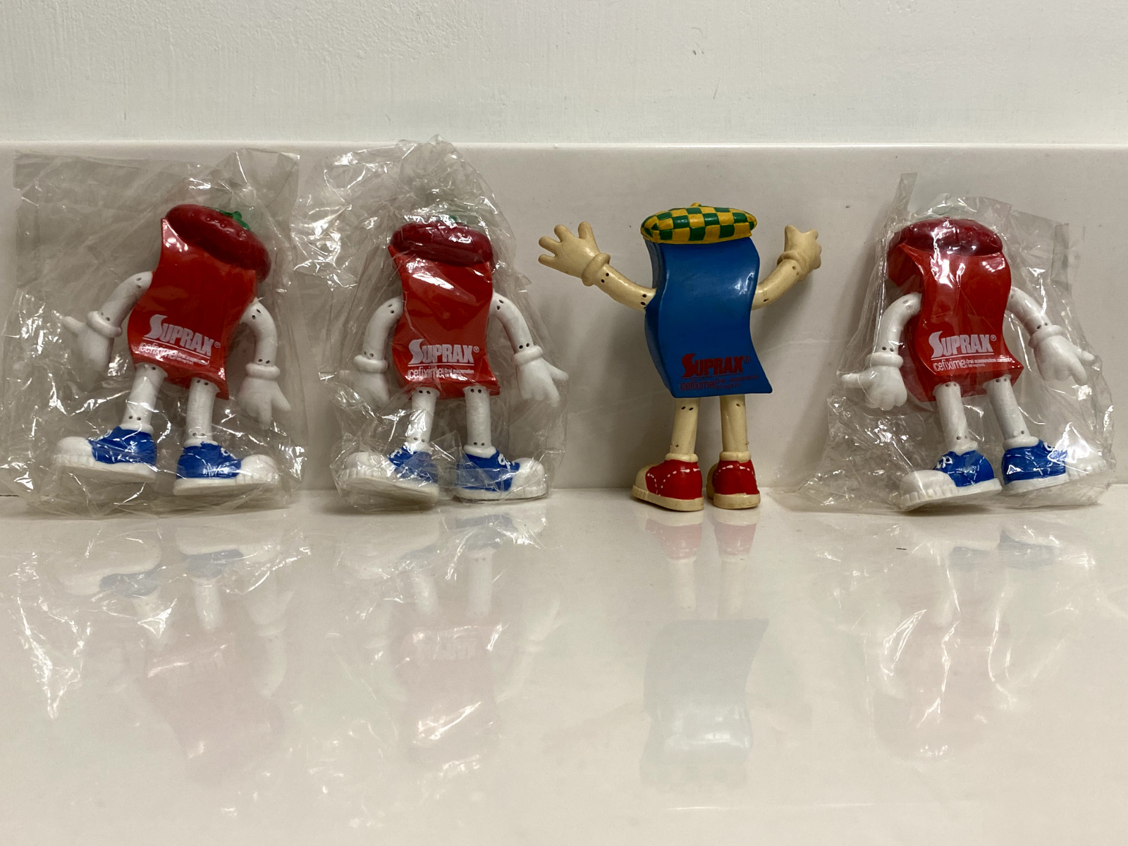 LOT OF 4 VINTAGE PHARMACEUTICAL DRUG REP SUPRAX BENDABLE ADVERTISING FIGURES TOY