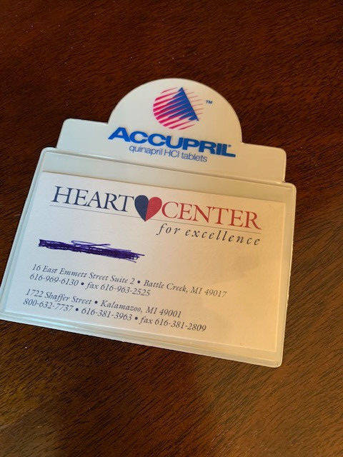 Drug Rep Accupril Flashlight, magnetic business card holder, and 3 magnets.