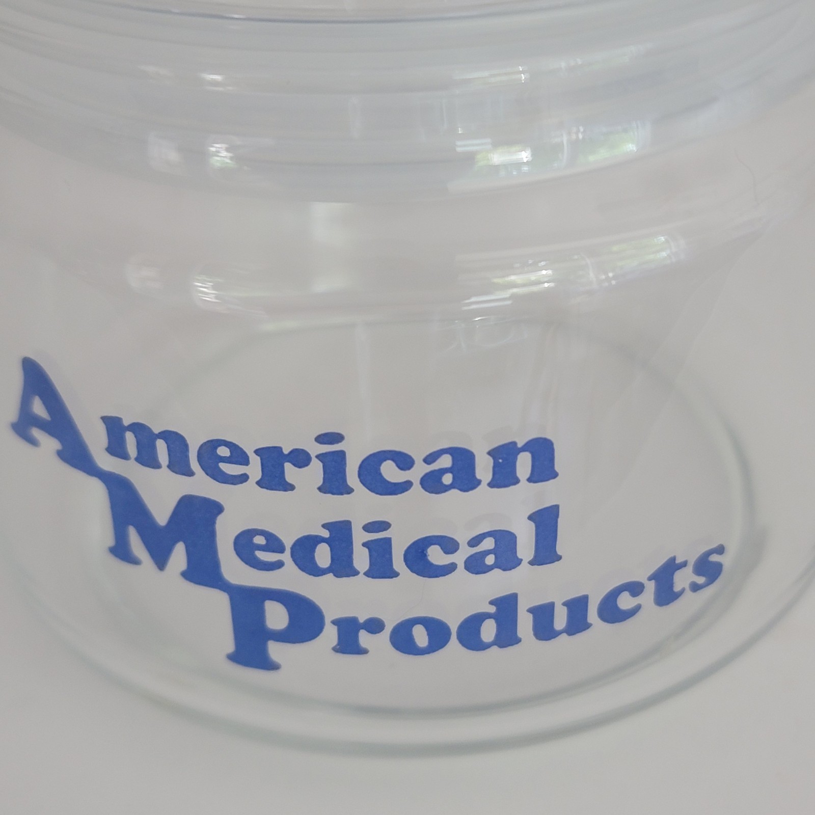 American Medical Products Clear Glass Jar Blue Writing 6″ VTG Retro
