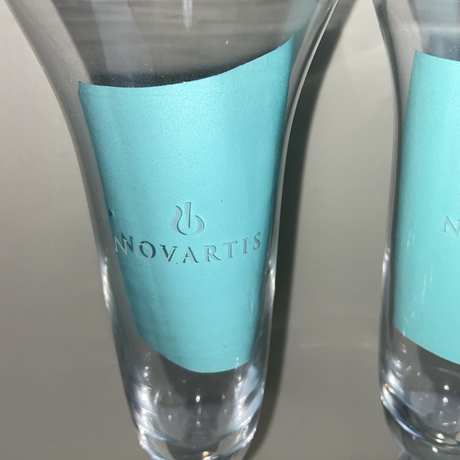 NOVARTIS Champagne Glasses Set Of 2 Clear Crystal 10” Tall Pharmacy Medical NOS