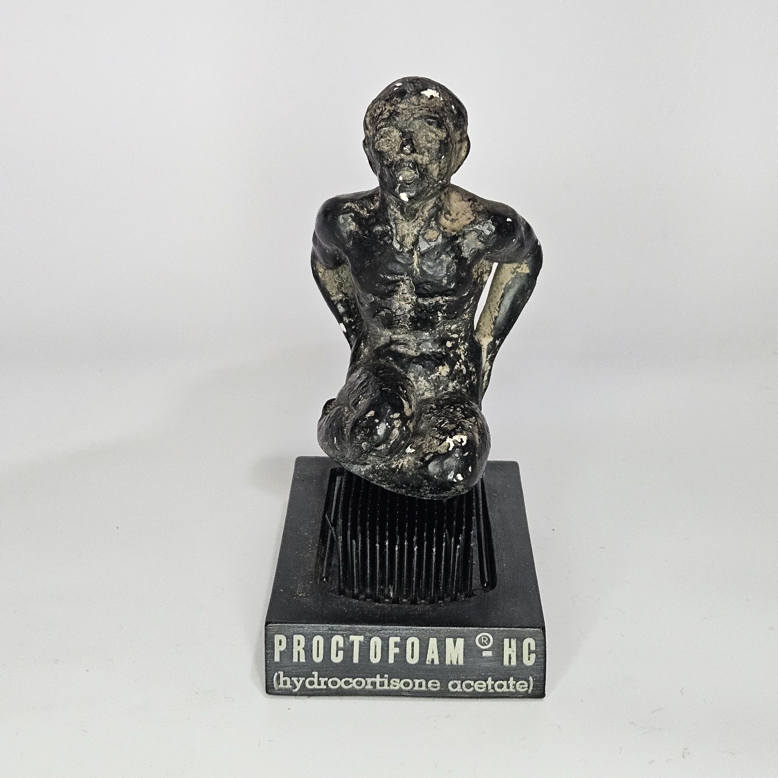 Vintage Proctofoam Pharmaceutical Advertising Bed Of Nails Fakir Figure