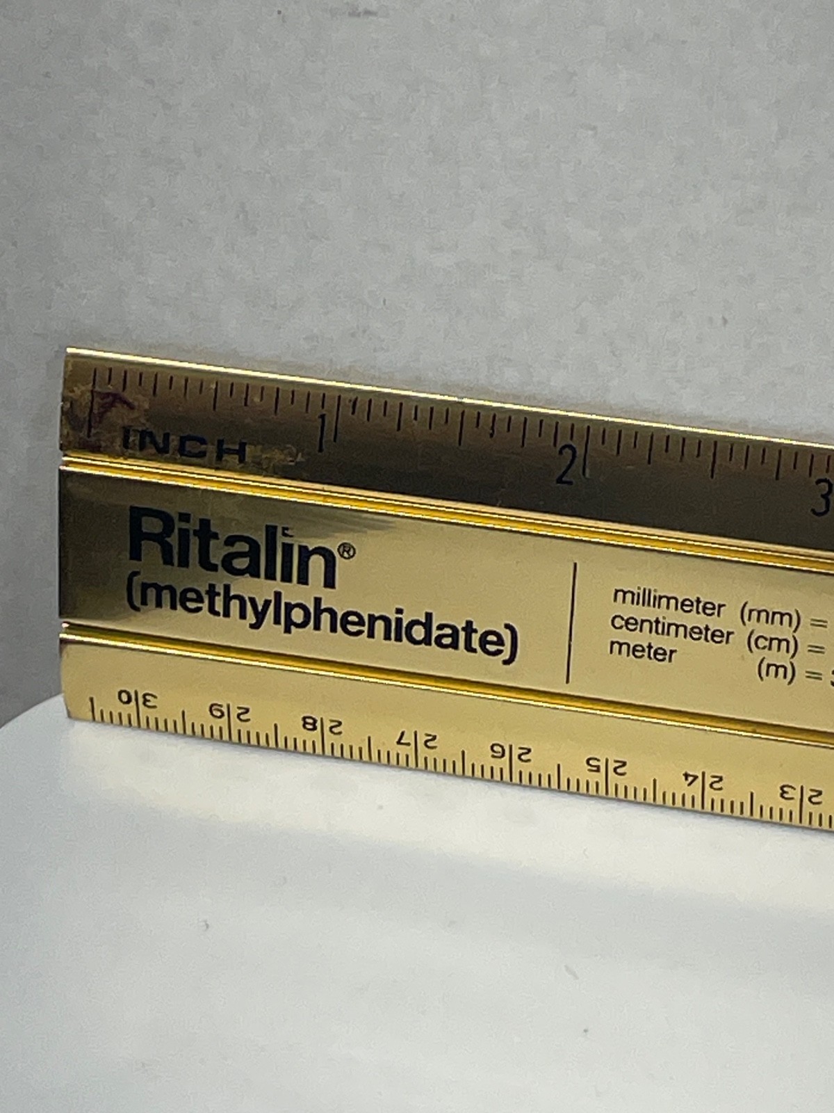 VINTAGE RITALIN CIBA 12″ METAL RULER! mm/METRIC CONVERSIONS! GOLD COLOR METAL!