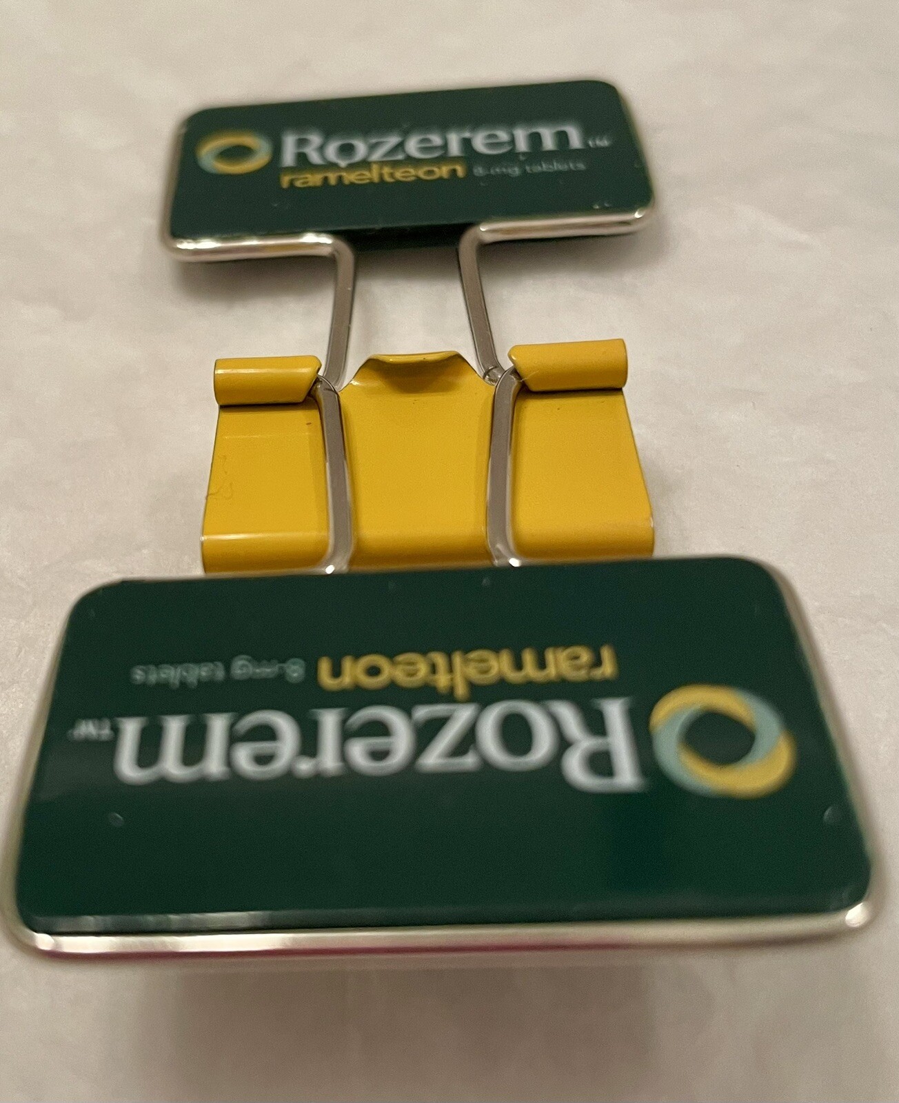 VINTAGE ROZEREM GREEN/YELLOW BINDER CLIP PHARMACEUTICAL DRUG REP LOGO NEW
