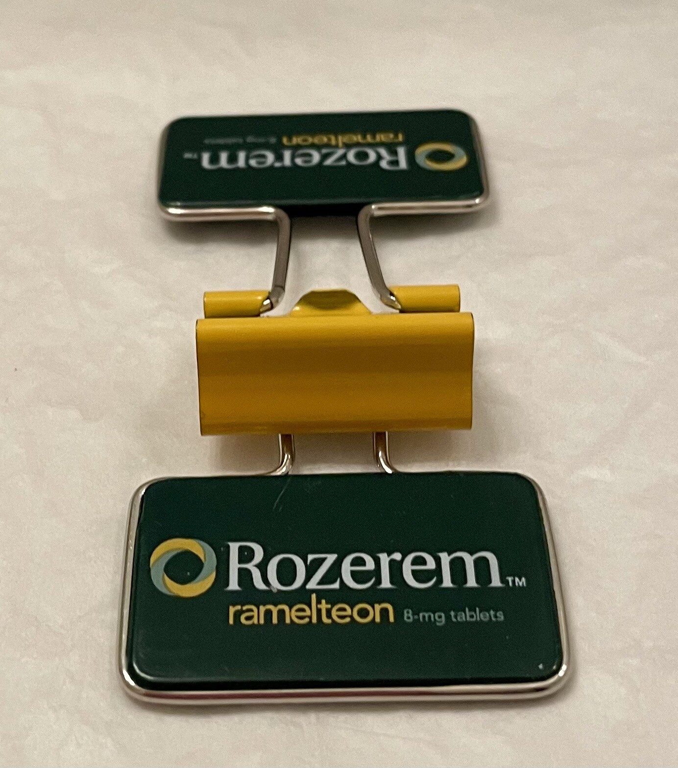 VINTAGE ROZEREM GREEN/YELLOW BINDER CLIP PHARMACEUTICAL DRUG REP LOGO NEW
