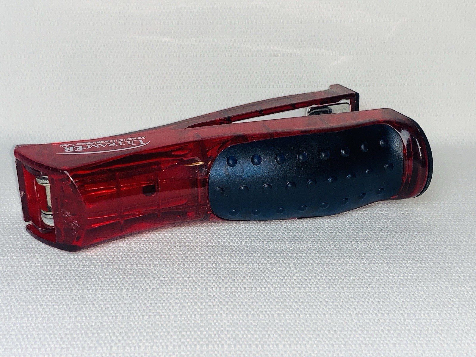 Ultram ER Drug Rep Promo Stapler – Red Translucent Stand-Up Ergonomic Squeeze