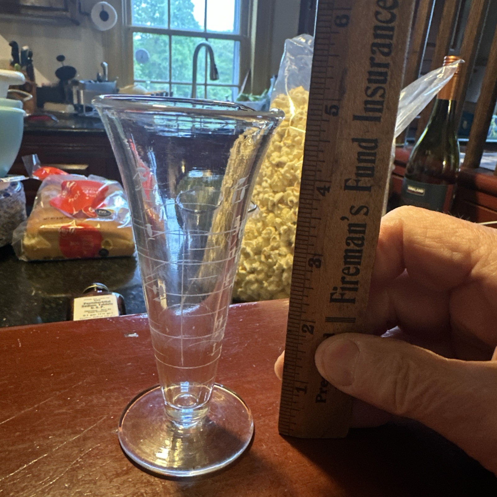 A Pharmacy Glass Graduate 8 Fluidrachms And One Fluidounce.