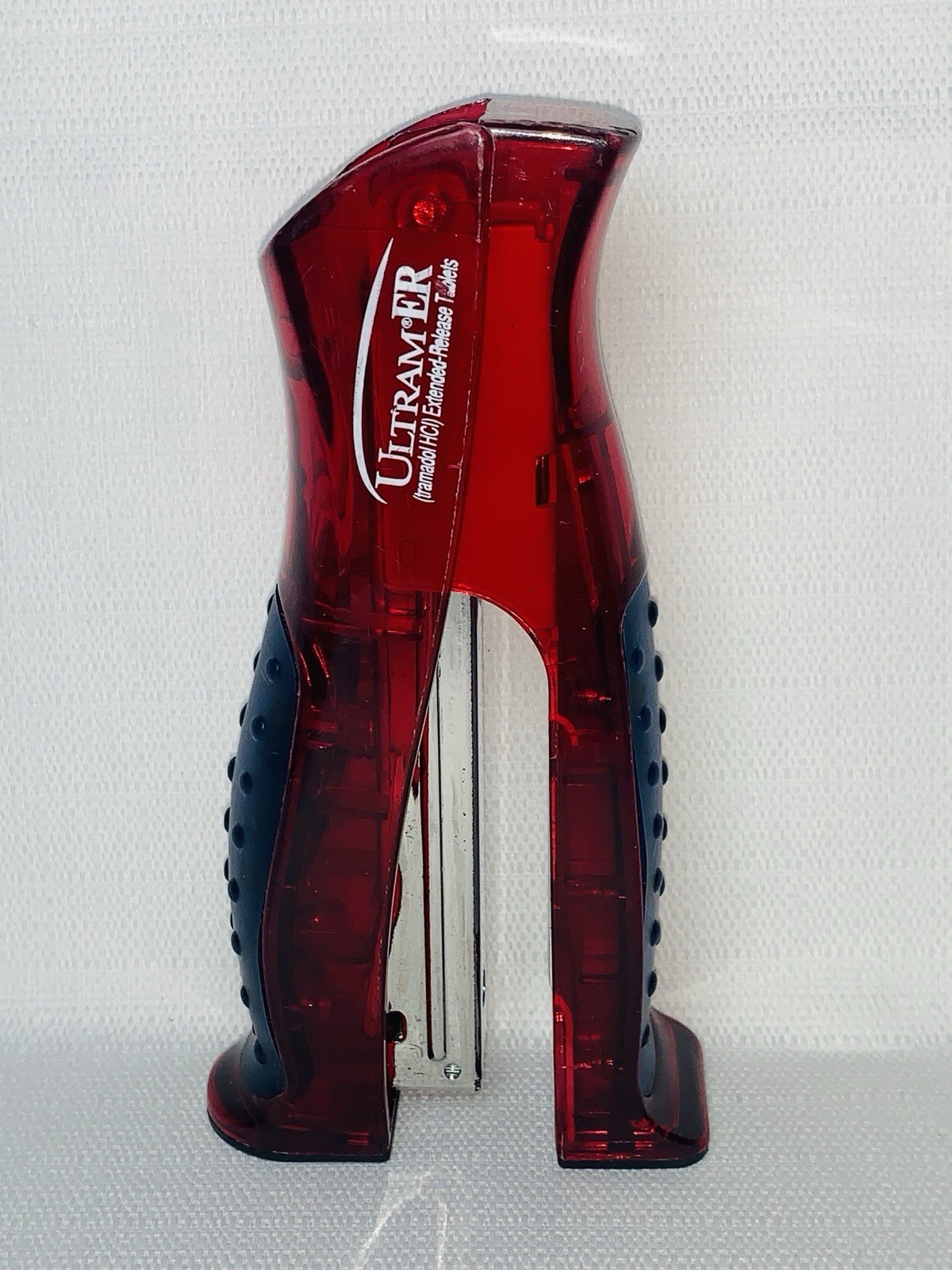 Ultram ER Drug Rep Promo Stapler – Red Translucent Stand-Up Ergonomic Squeeze