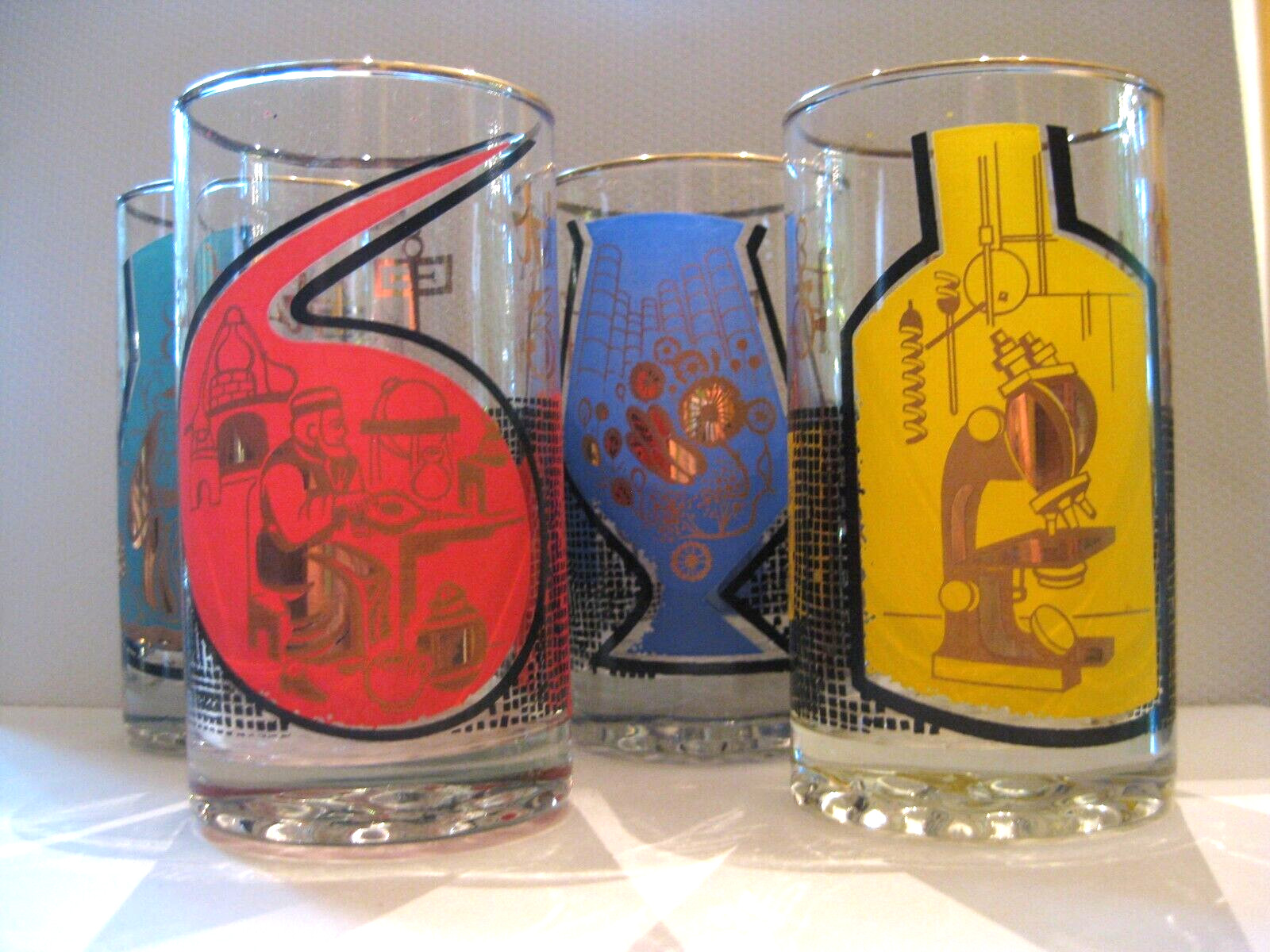 1960s Roerig Pharmaceutical Highball Glasses Set of Four Multi-Color Graphics