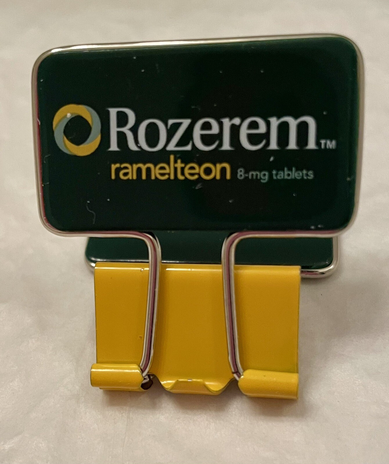 VINTAGE ROZEREM GREEN/YELLOW BINDER CLIP PHARMACEUTICAL DRUG REP LOGO NEW