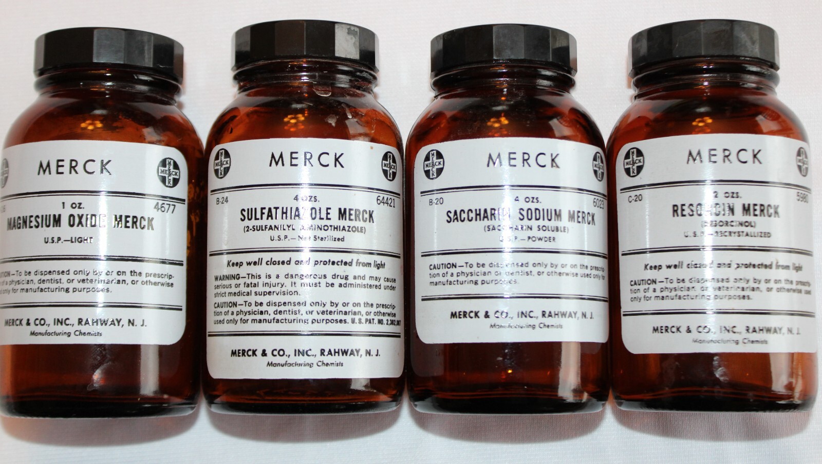 LOT OF 4 VINTAGE AMBER MEREK PHARMACEUTICAL APOTHECARY-MEDICINE BOTTLES 5″ JARS