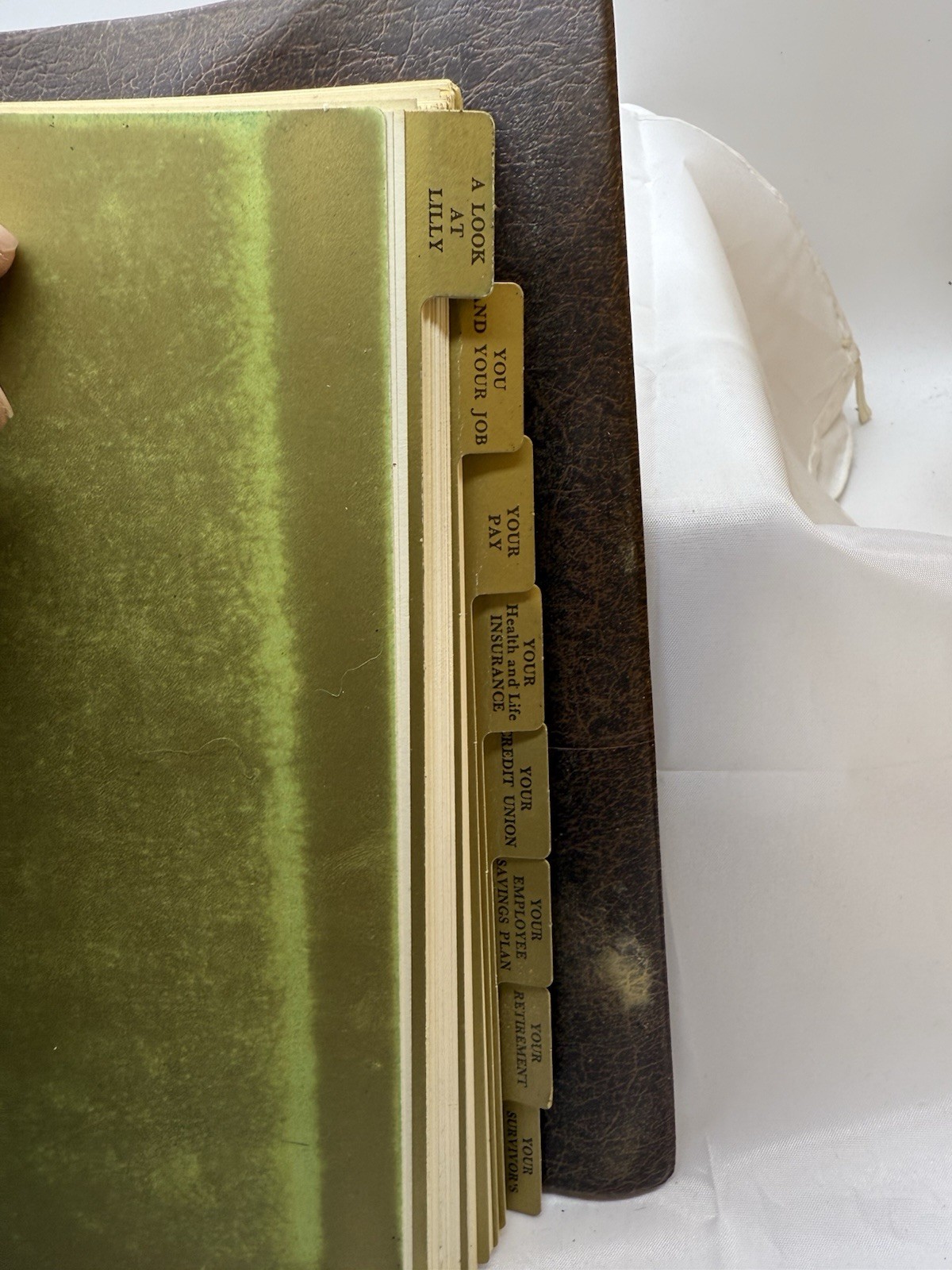 1976 Eli Lilly Employee Information binder – pay, insurance, credit union info