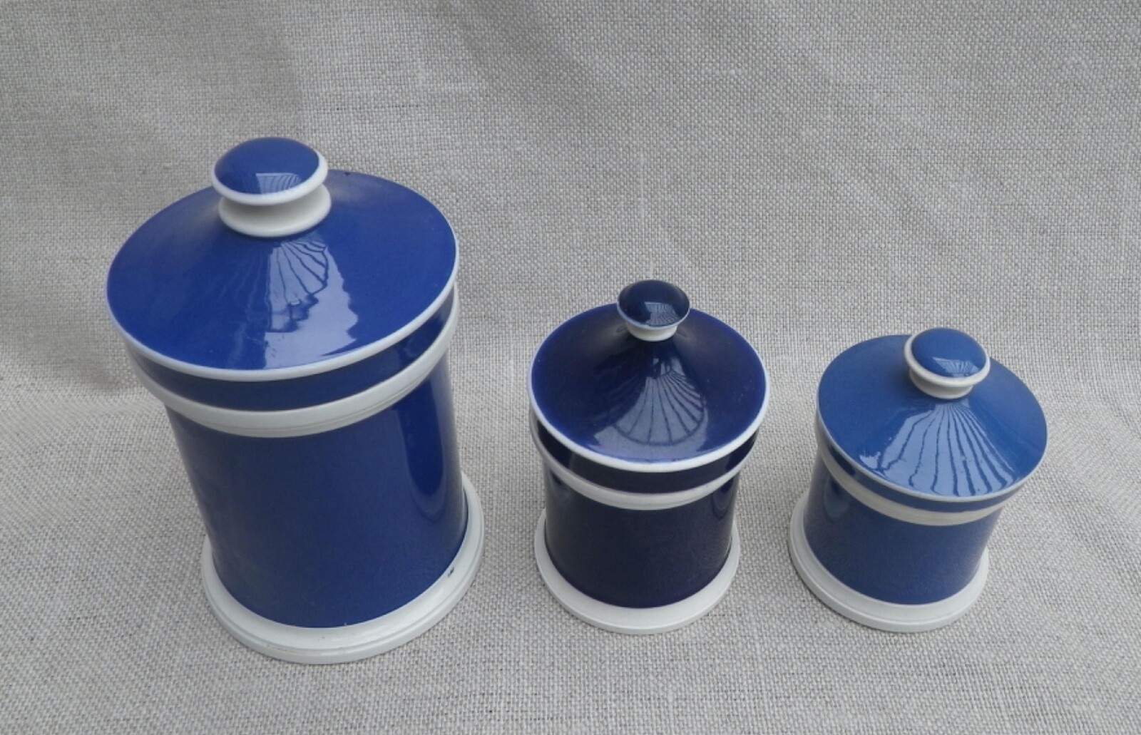 Collection of Small Blue Slip-Decorated Ceramic Apothecary Jars with Lids