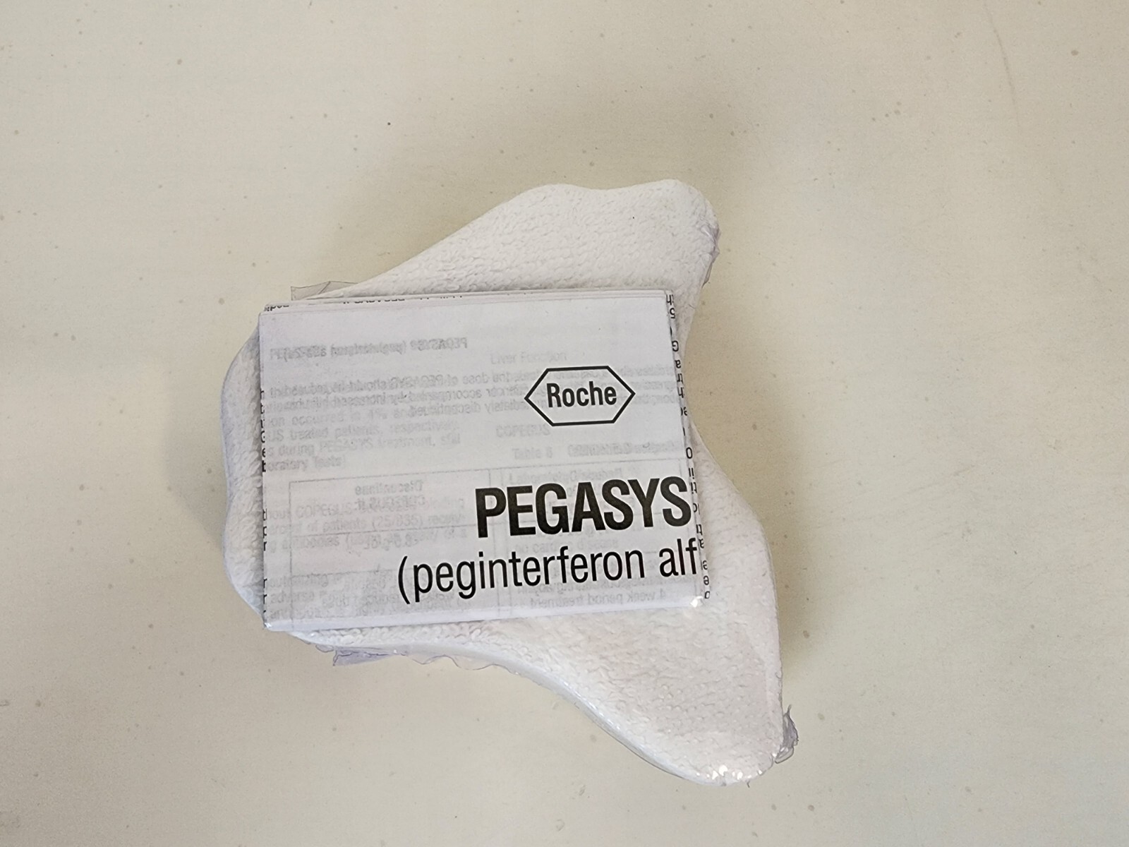 pharmaceutical drug rep collectibles Pegasys towel in plastic. Roche