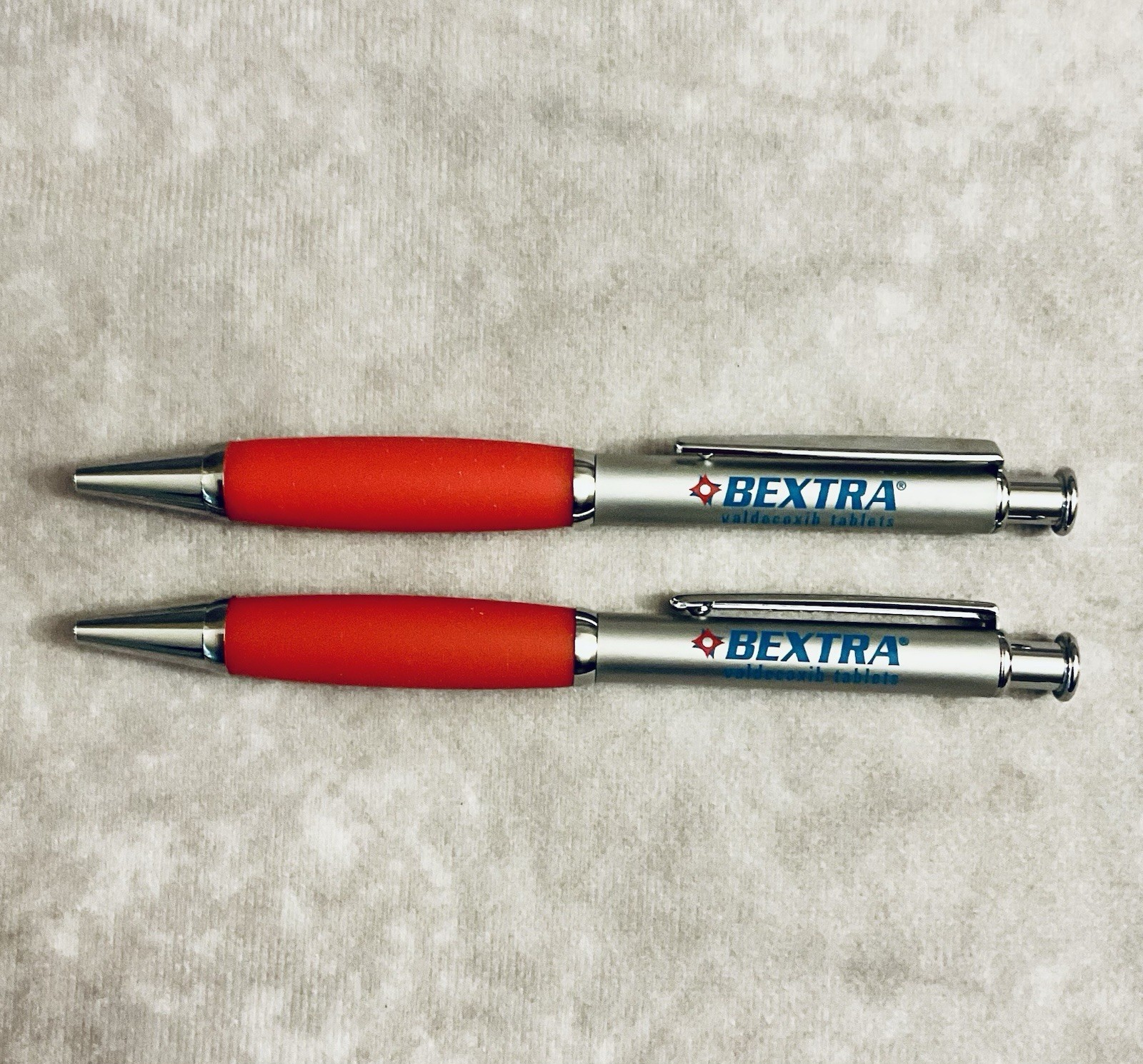 BEXTRA PHARMACEUTICAL REP PEN METAL RETRACTABLE REFILLABLE RED GRIP LOT OF 2
