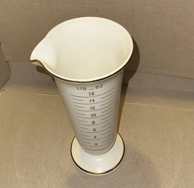 Vintage Owens Illinois Pharmacy Porcelain Measuring Cup Gold Trim 9″ Tall Beaker