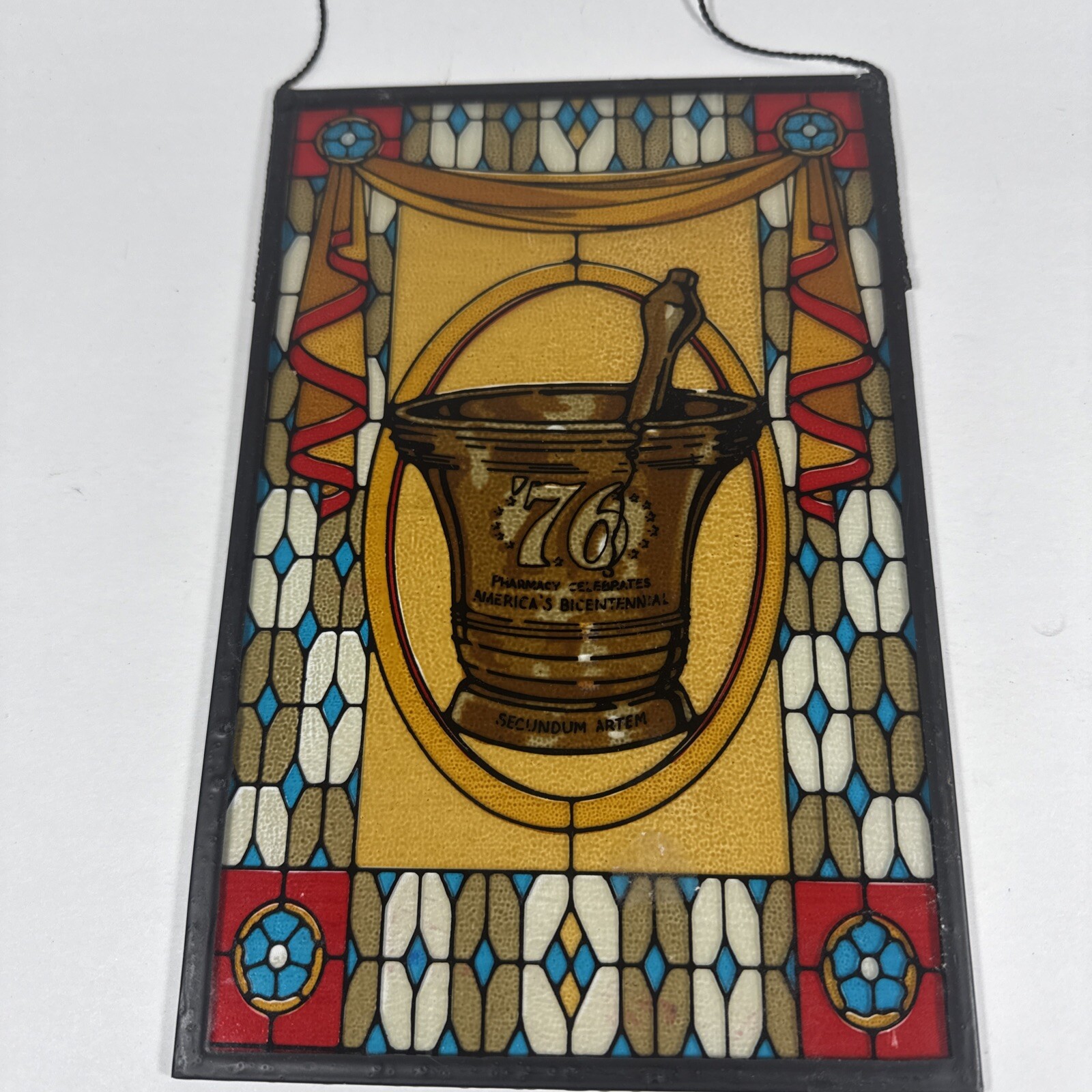 SECUNDUM ARTEM ’76, PHARMACY CELEBRATES AMERICA’S BICENTENNIAL STAINED GLASS