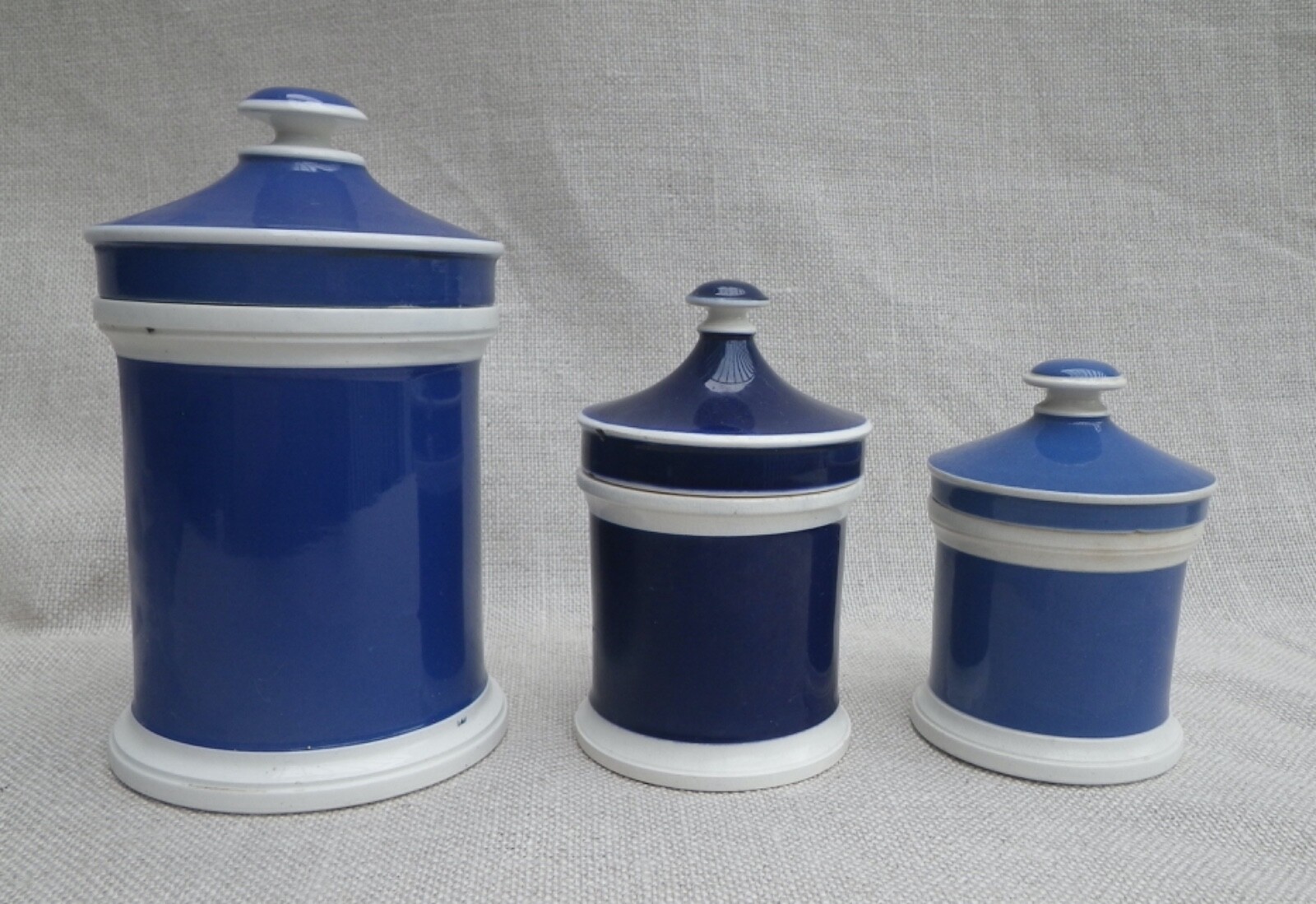 Collection of Small Blue Slip-Decorated Ceramic Apothecary Jars with Lids