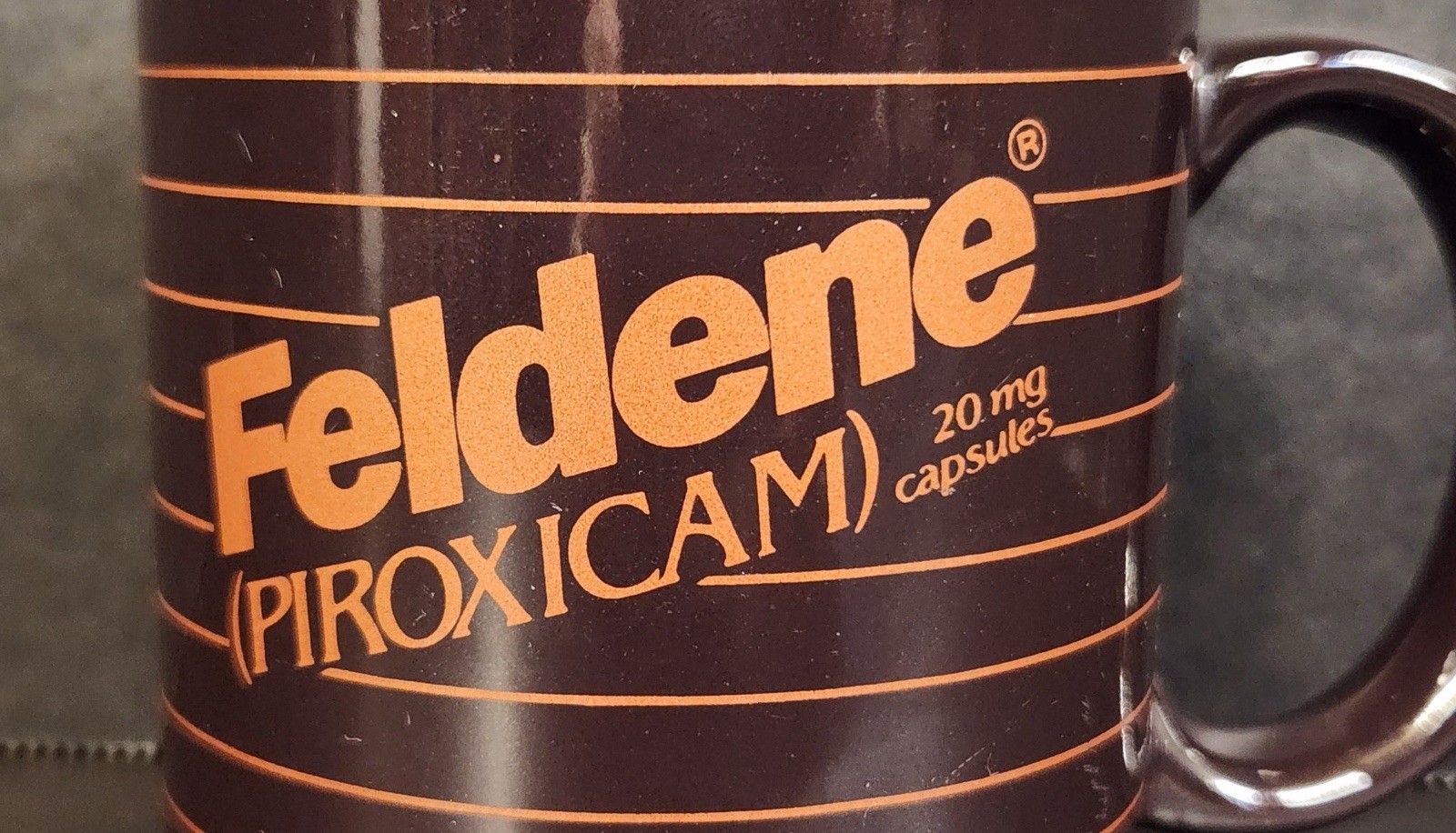 Vintage Feldene Piroxicam 20mg Pharmaceutical Advertising Coffee Mug Brown Promo