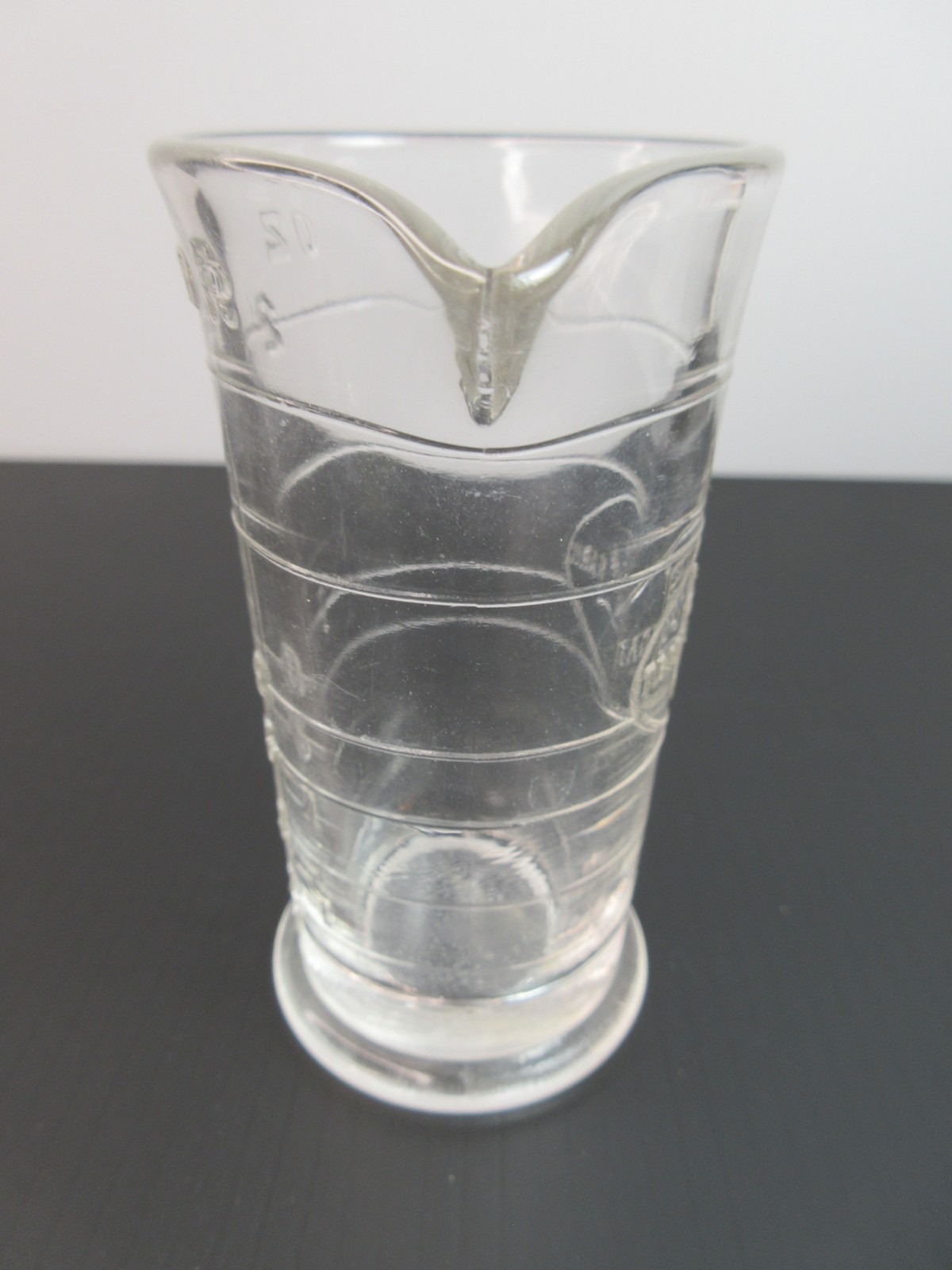 1930’s ENSIGN UK Footed Glass Embossed APOTHECARY MEASURE BEAKER Ounces & Drams