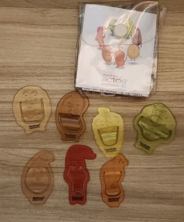 Actos Drug Rep Plastic Character Paper Clips Lot Of 7 In Plastic Case RARE!!
