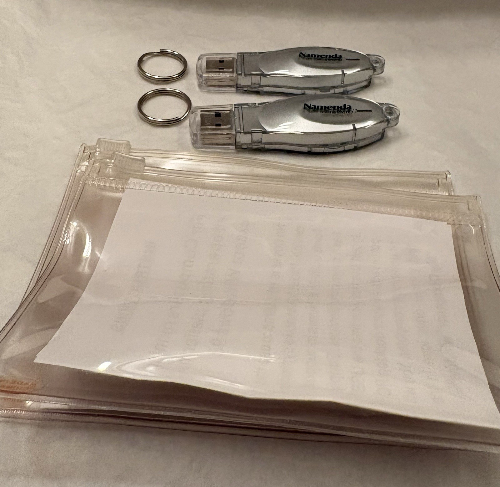 VTG LOT OF 2 NAMENDA USB FLASH MEMORY DEVICES + KEYRINGS PHARMA REP LOGO NEW