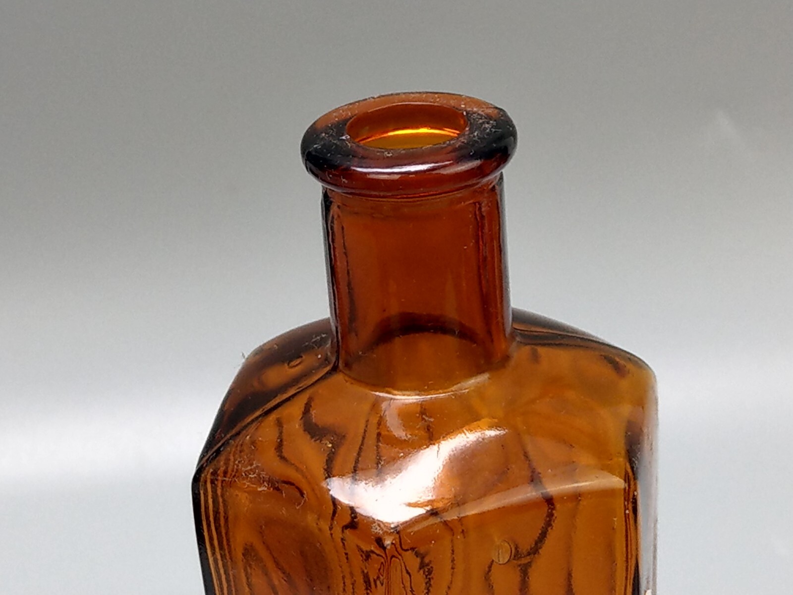 Vintage brown glass chemist bottle with label: Methylated Spirit L.T. Leader