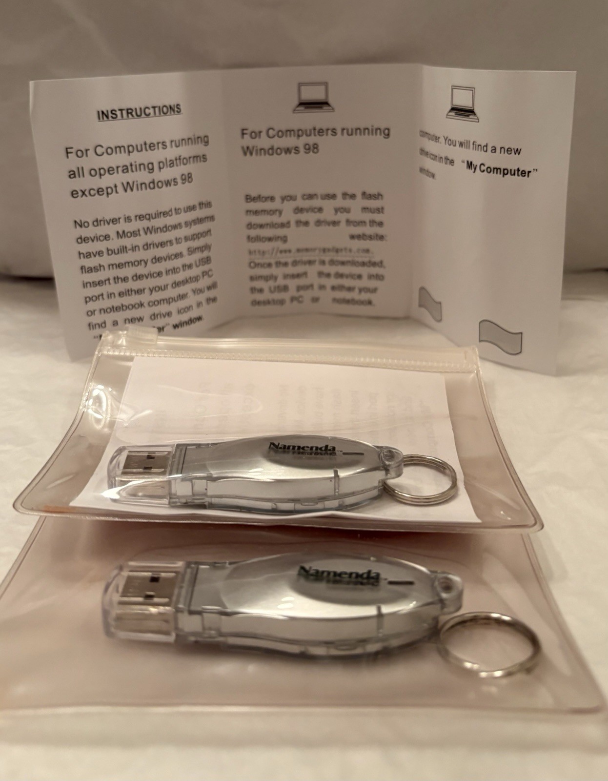 VTG LOT OF 2 NAMENDA USB FLASH MEMORY DEVICES + KEYRINGS PHARMA REP LOGO NEW
