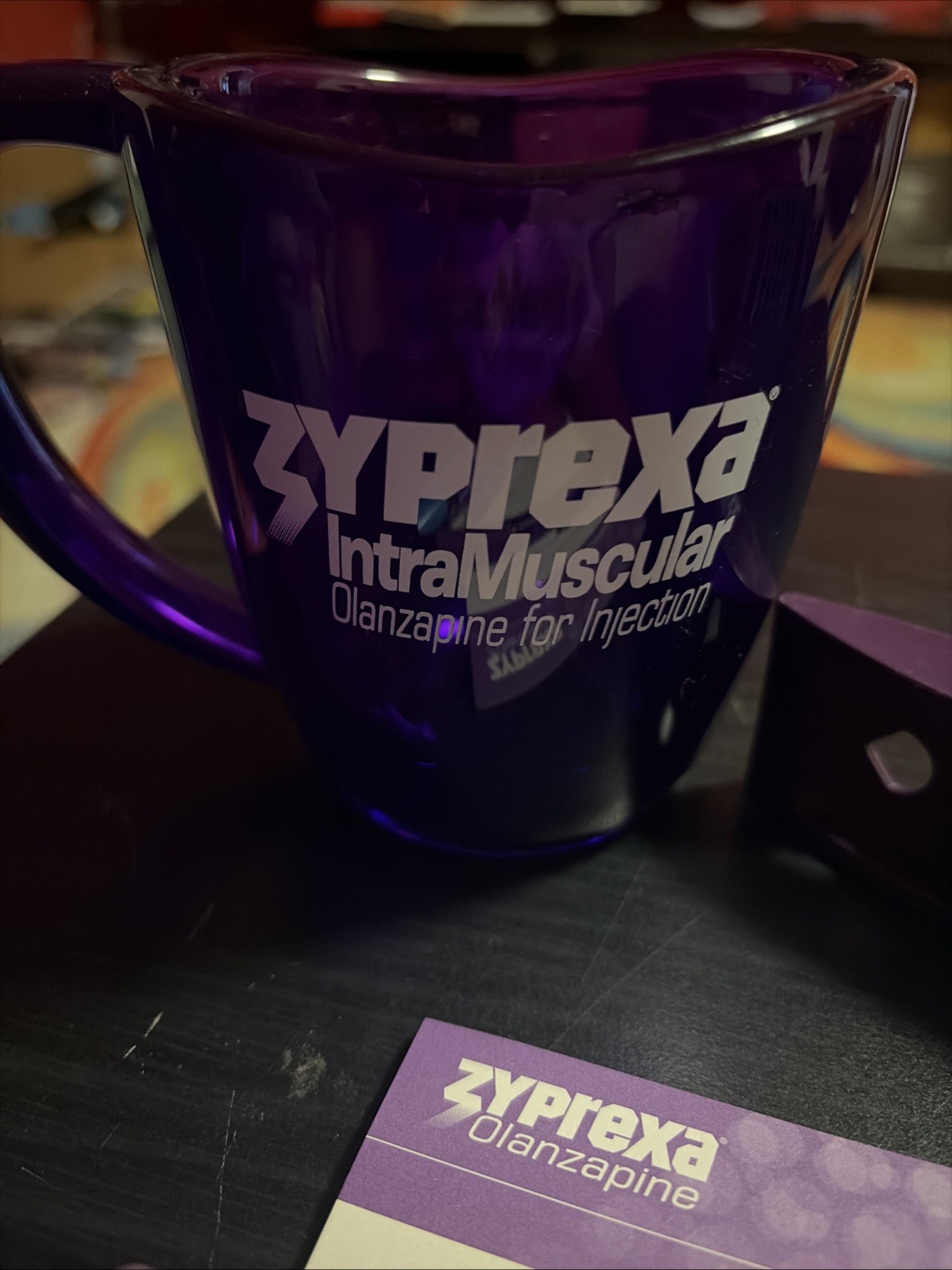 Zyprexa early 2000s collectible merch, 3 different pens, level, and mug