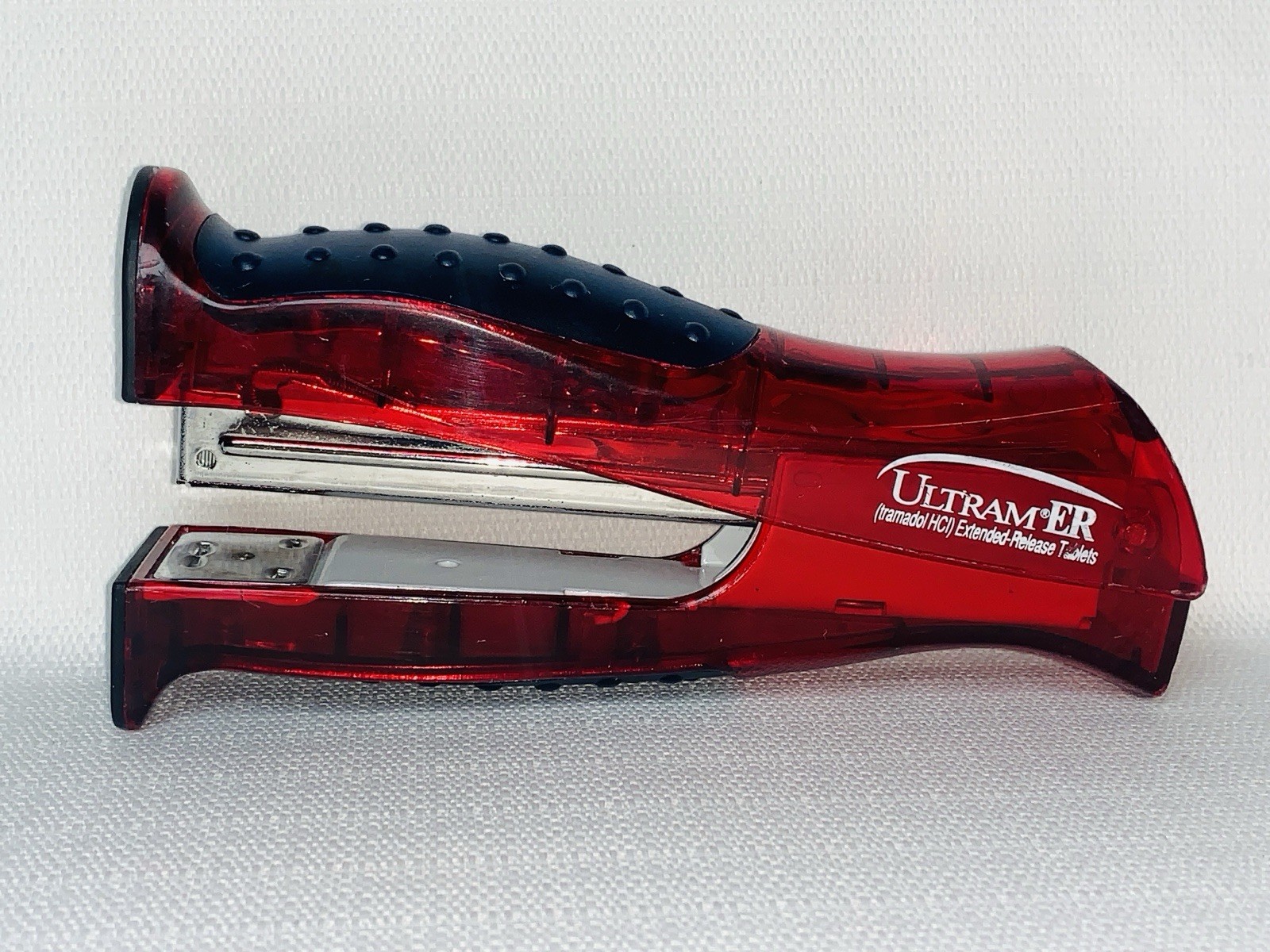 Ultram ER Drug Rep Promo Stapler – Red Translucent Stand-Up Ergonomic Squeeze