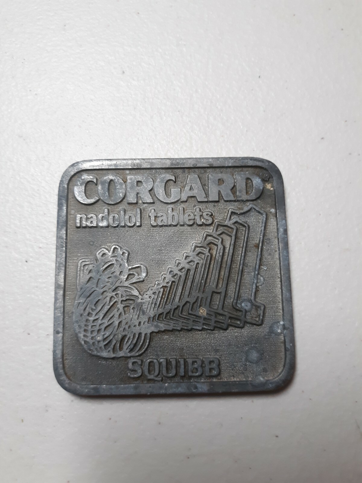 Vtg Metal Advertising Paperweight SQUIBB Medicine Drug Corgard Nadolol Tablets